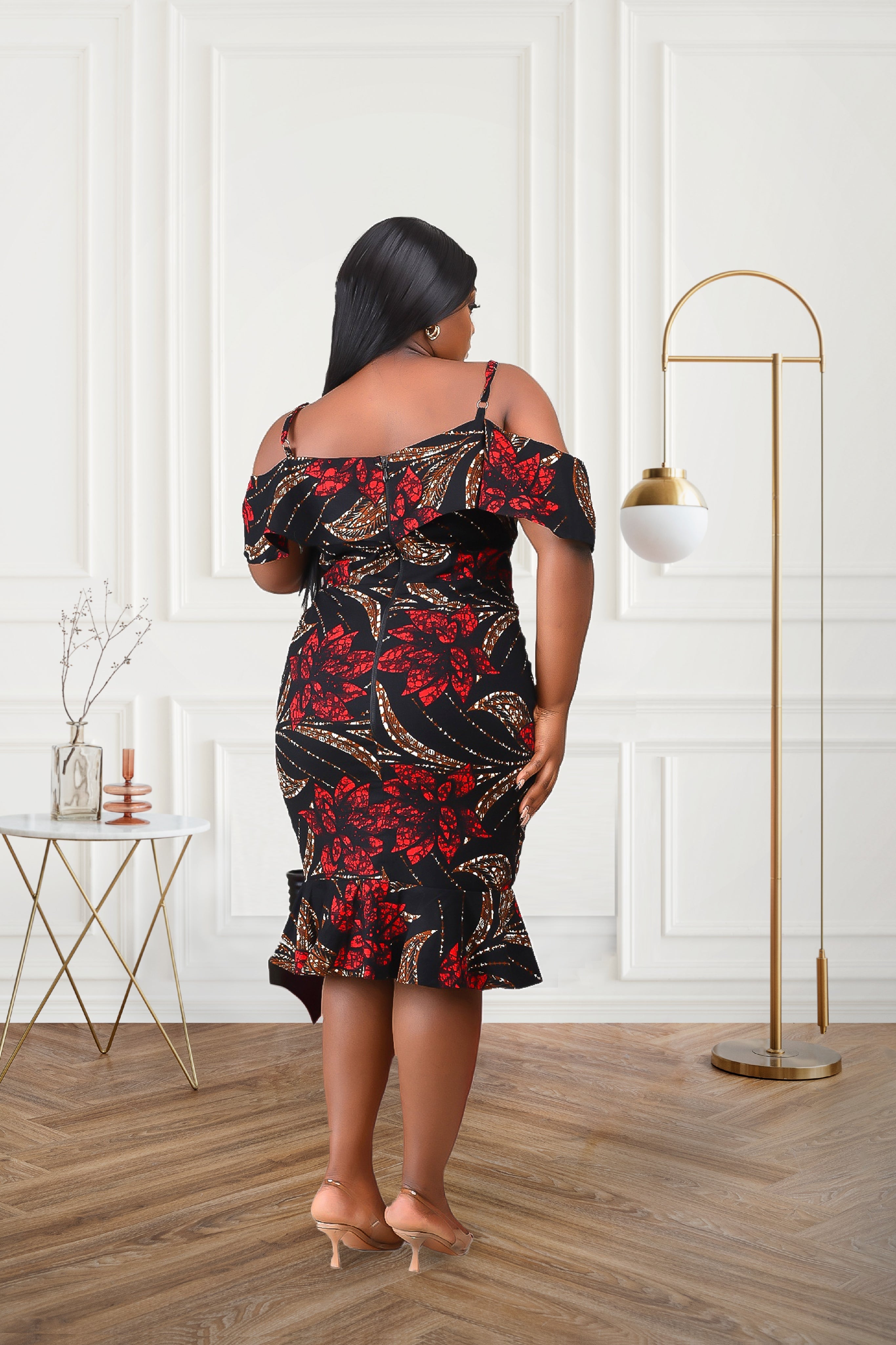Woman in an African print cold shoulder multicolored red black brown midi dress outfit